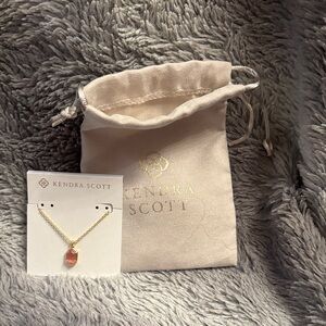Kendra Scott Gold Necklace with Pink Pendant.